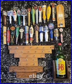 25 beer tap handles (Troegs, Heinekin), stands, Miller High Life bottle opener